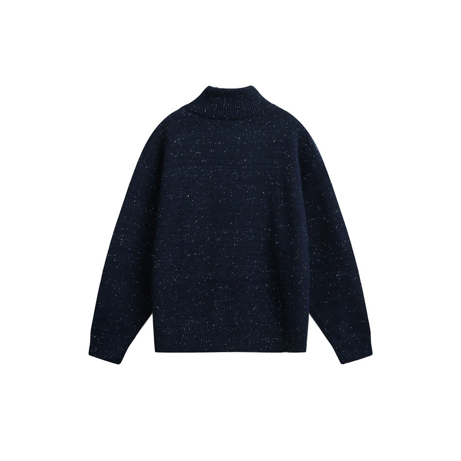 Back view of a navy speckled knit sweater with a ribbed stand collar, cuffs, and hem.