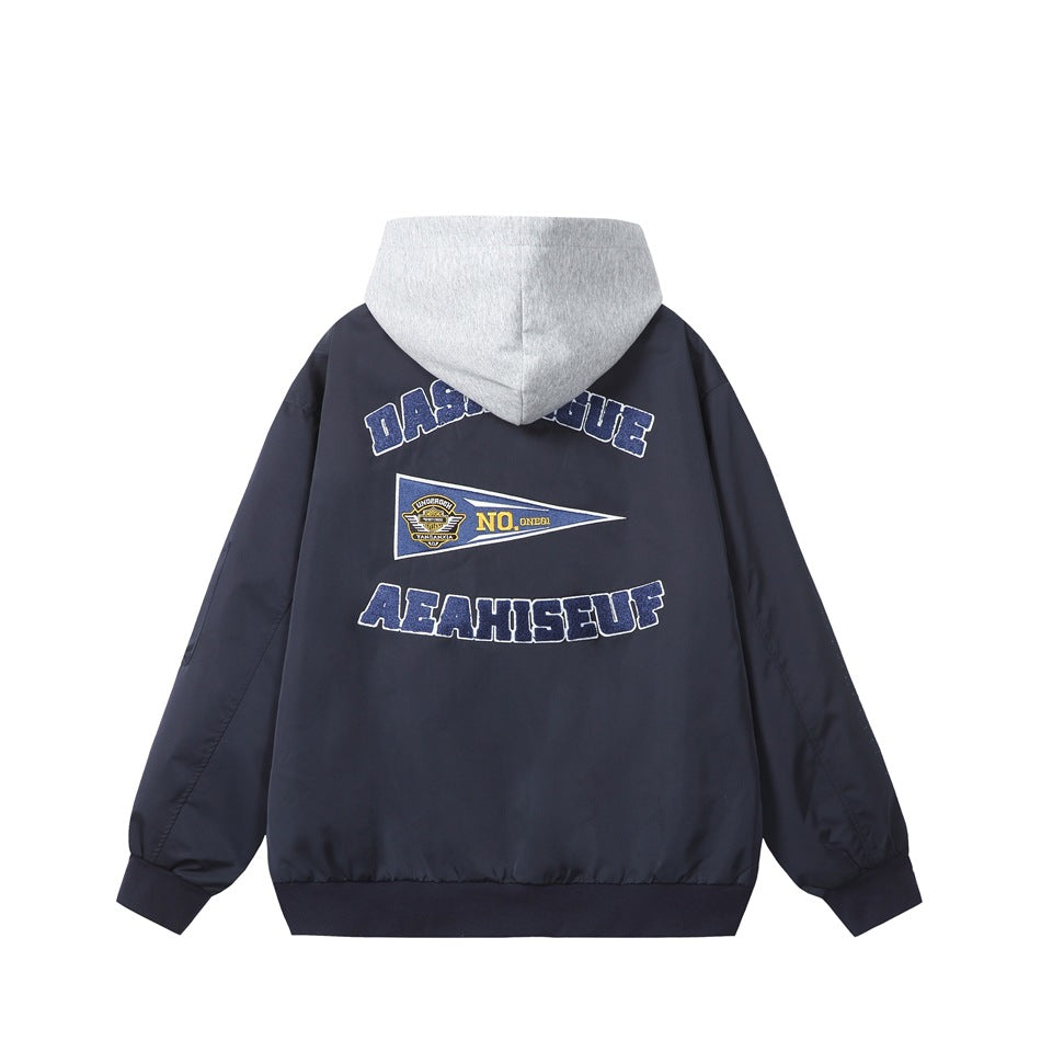 Back view of a navy hooded zip jacket with a gray hood and large embroidered lettering and pennant graphics.