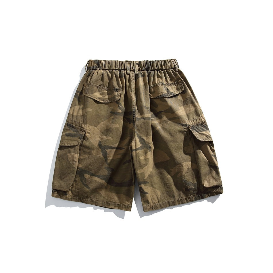 Back view of olive-brown camouflage cargo shorts with an elastic waistband and large flap pockets.