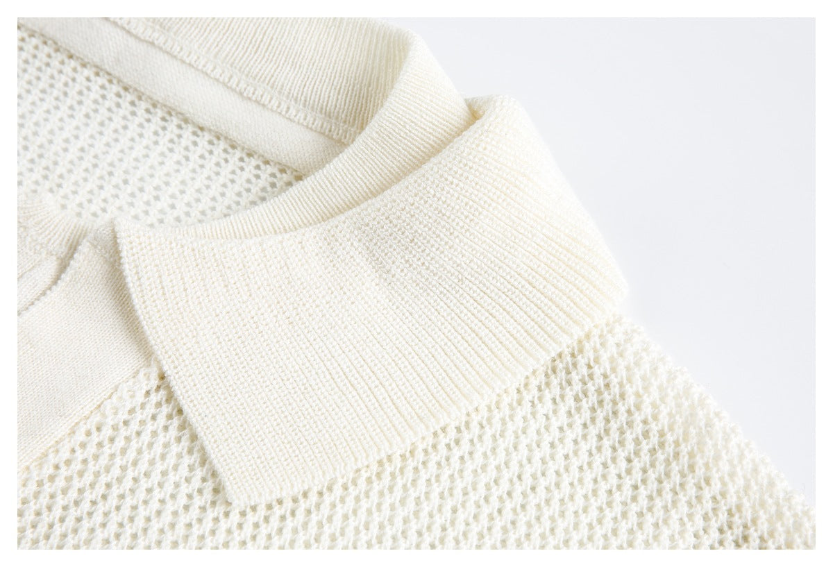 Close-up showing the wide ribbed collar and open-knit texture of an ivory polo top.