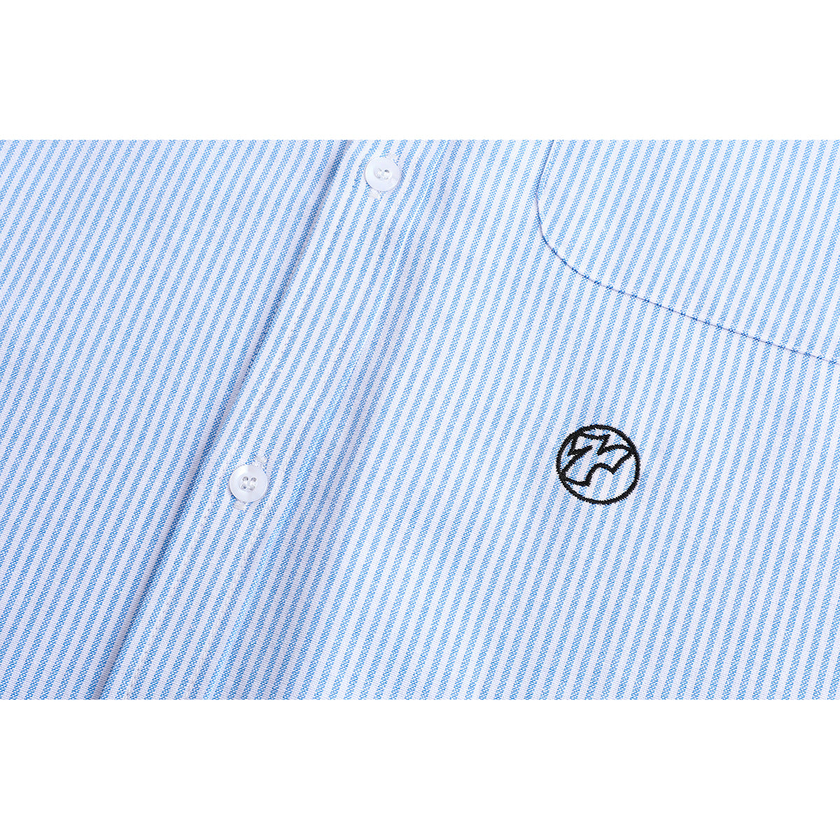Close-up of a light blue and white striped shirt chest with white buttons, a pocket edge, and a small embroidered emblem.