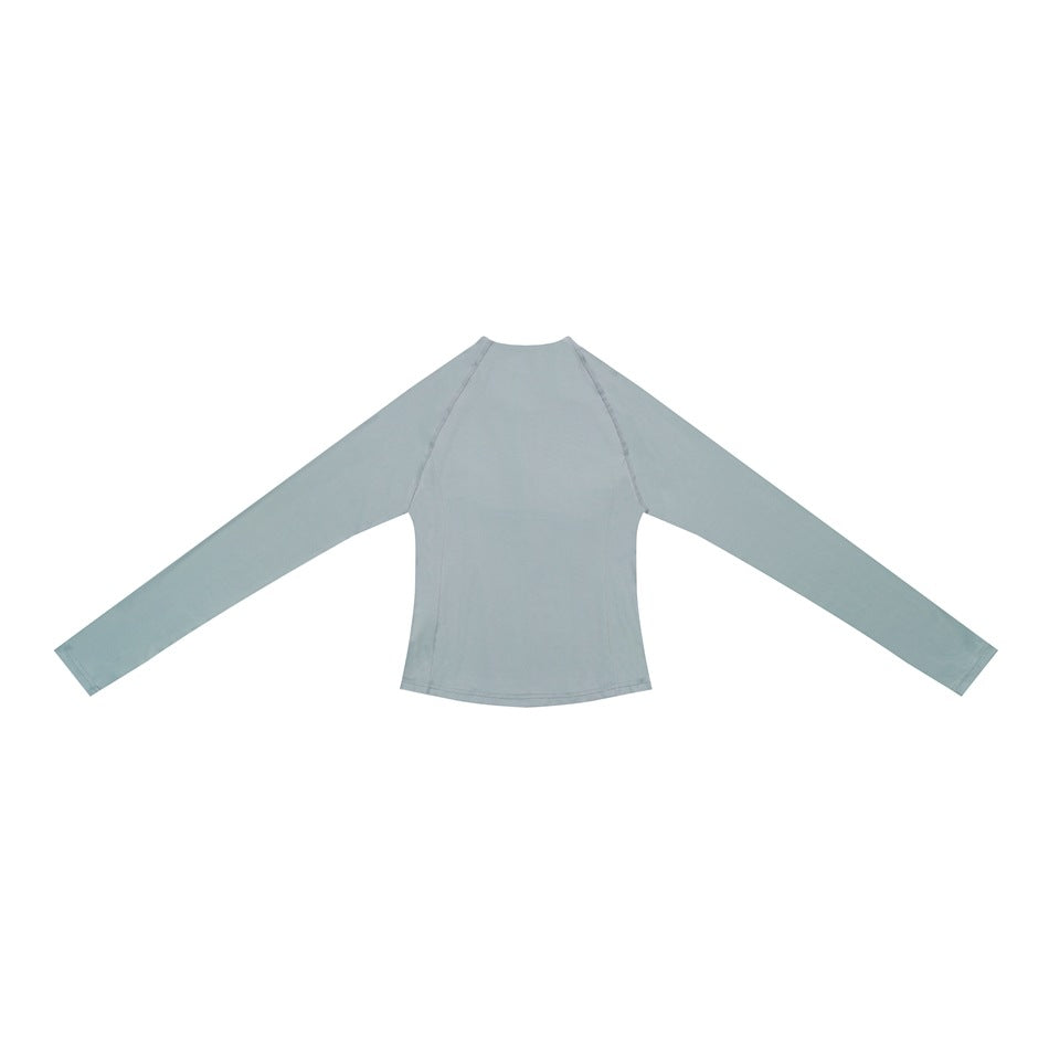 Light gray long-sleeve top laid flat, with a round neckline and raglan seams.