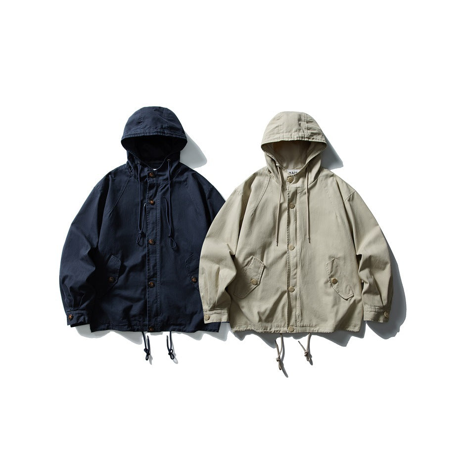 Two hooded button-front jackets displayed side by side in navy and light beige.