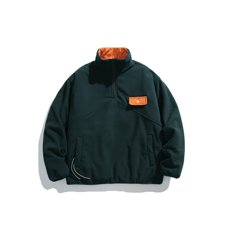 Dark green half-zip fleece-like jacket with orange collar lining and orange flap chest pocket, front flat lay