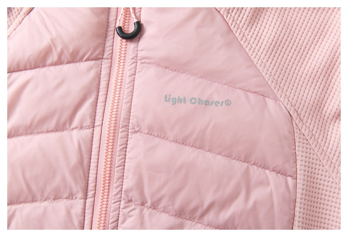 Close-up of a pink jacket with horizontal quilting, a textured panel, zipper, and small gray chest logo.