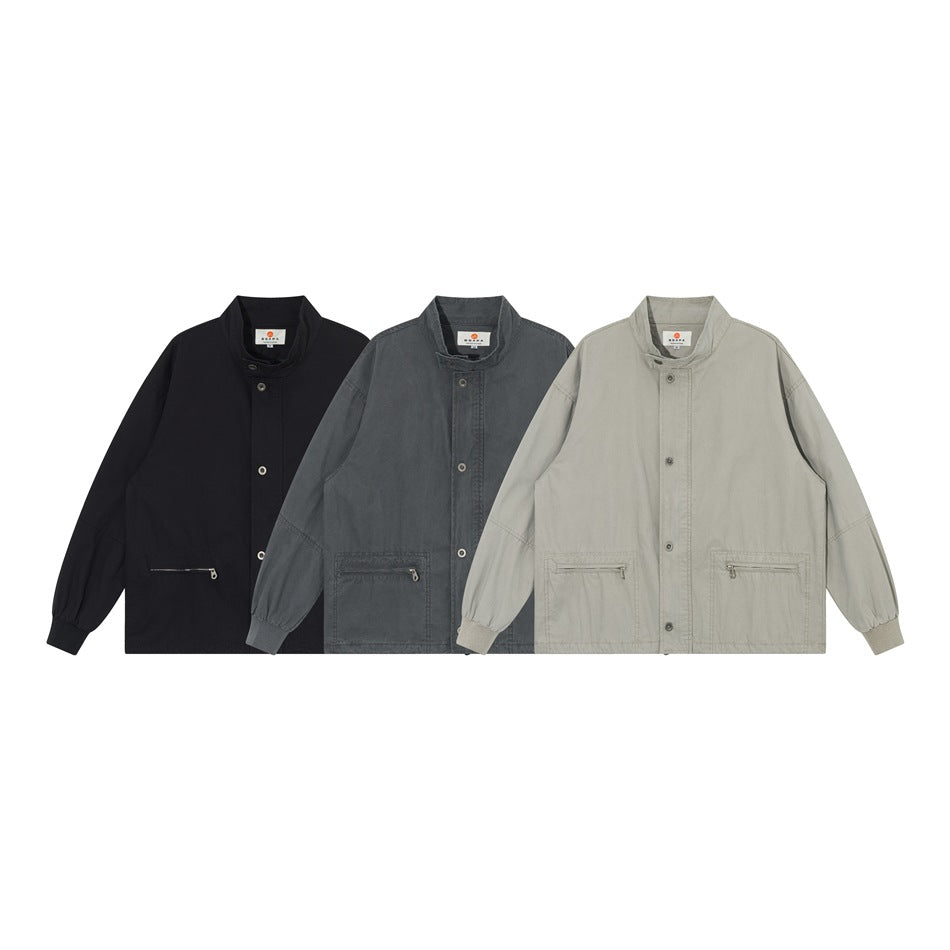 Three front views of a stand-collar jacket with zip pockets in black, charcoal gray, and light gray.