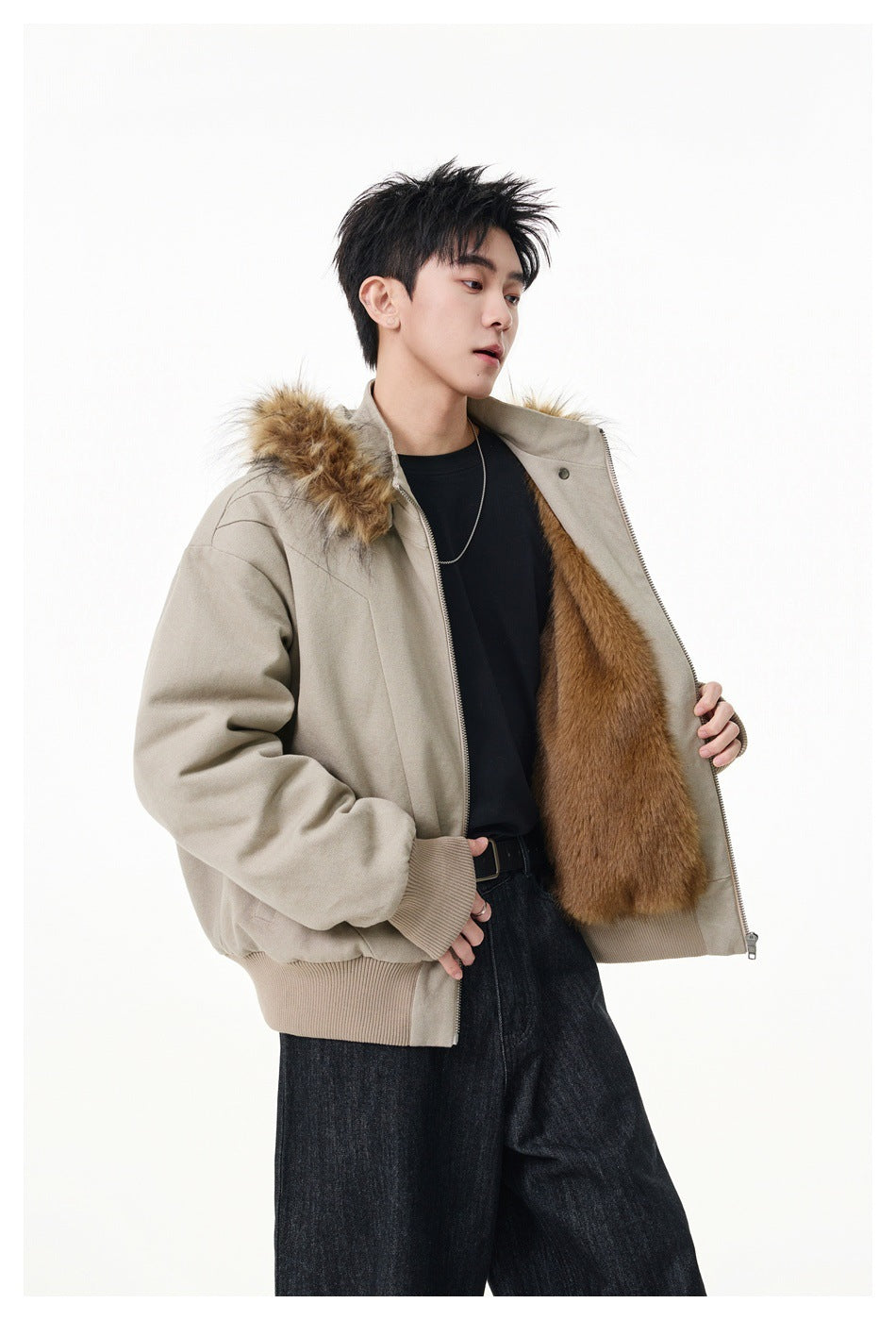 Model holds open a light beige jacket to show its plush tan lining and fur-trimmed hood.