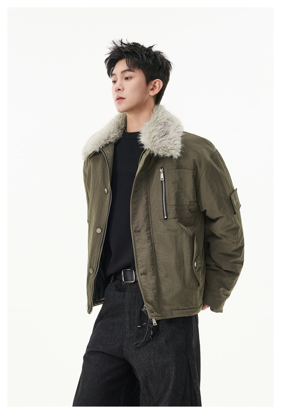 Three-quarter view of a model wearing the olive jacket with a plush light collar and zip chest pocket.