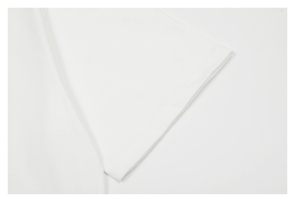 Close-up of a white garment sleeve edge and stitched hem.