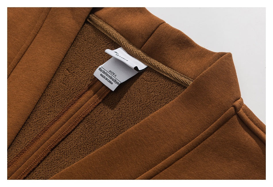 Close-up of the brown garment's textured inside, seam, and sewn-in label.