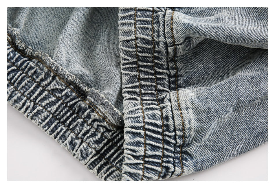 Close-up of gathered elastic denim and stitched seams.