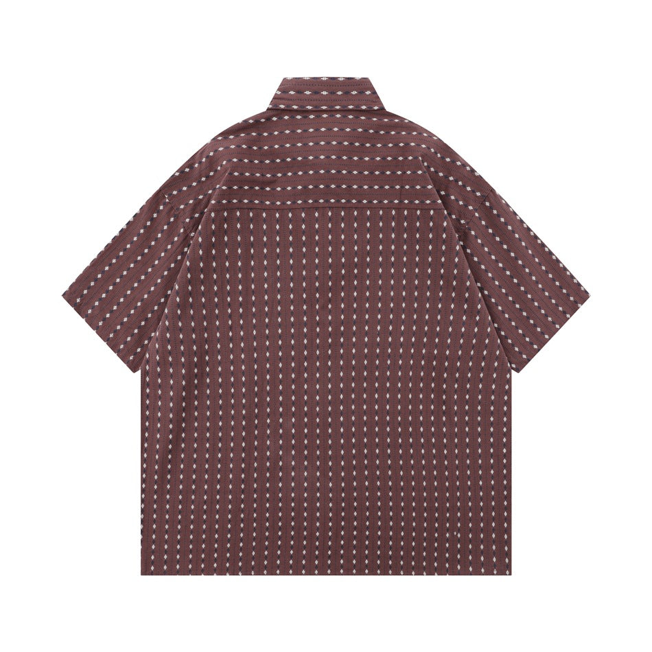 Back view of a burgundy short-sleeve button-up shirt with a small white repeating pattern.
