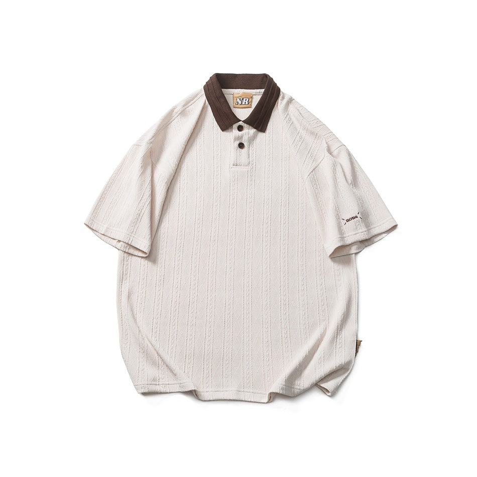 Cream short-sleeve textured knit polo shirt with dark brown collar and two buttons, flat lay front view