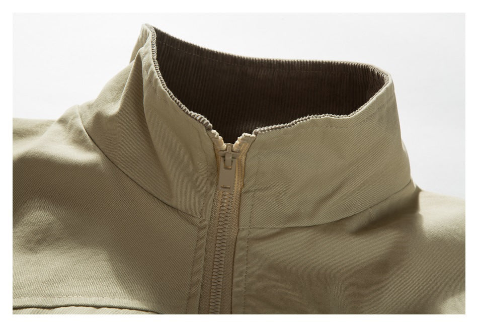 Close-up of a light khaki jacket's high collar, dark ribbed lining, and front zipper.
