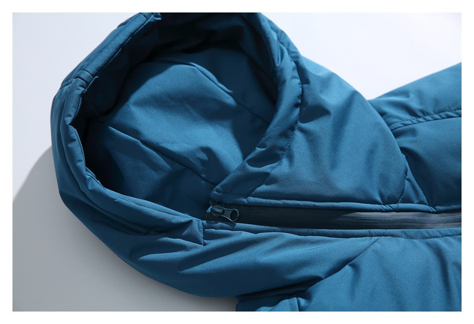 Close-up of a teal-blue jacket hood and its black front zipper on a white background.