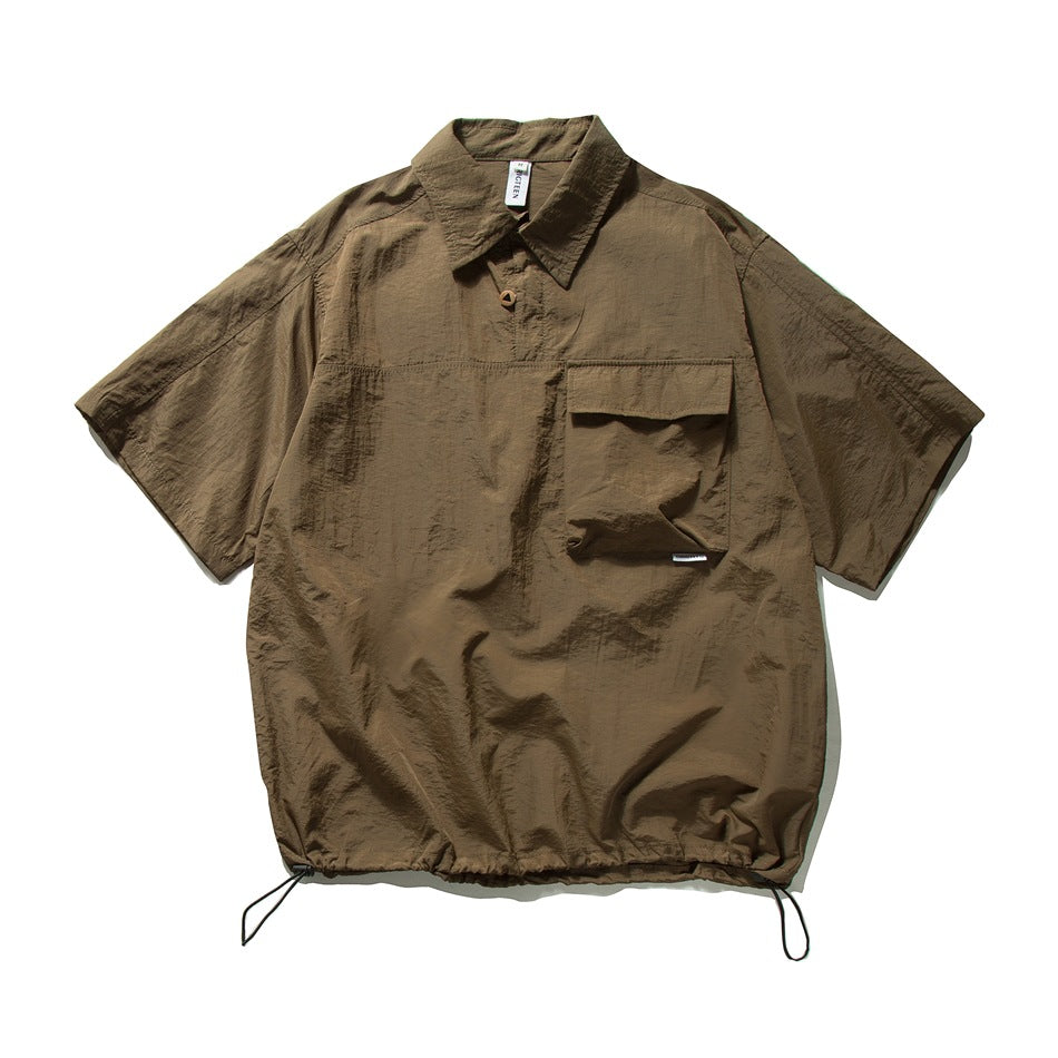 Coffee brown short-sleeve collared pullover shirt with a flap chest pocket and drawstring hem, flat view