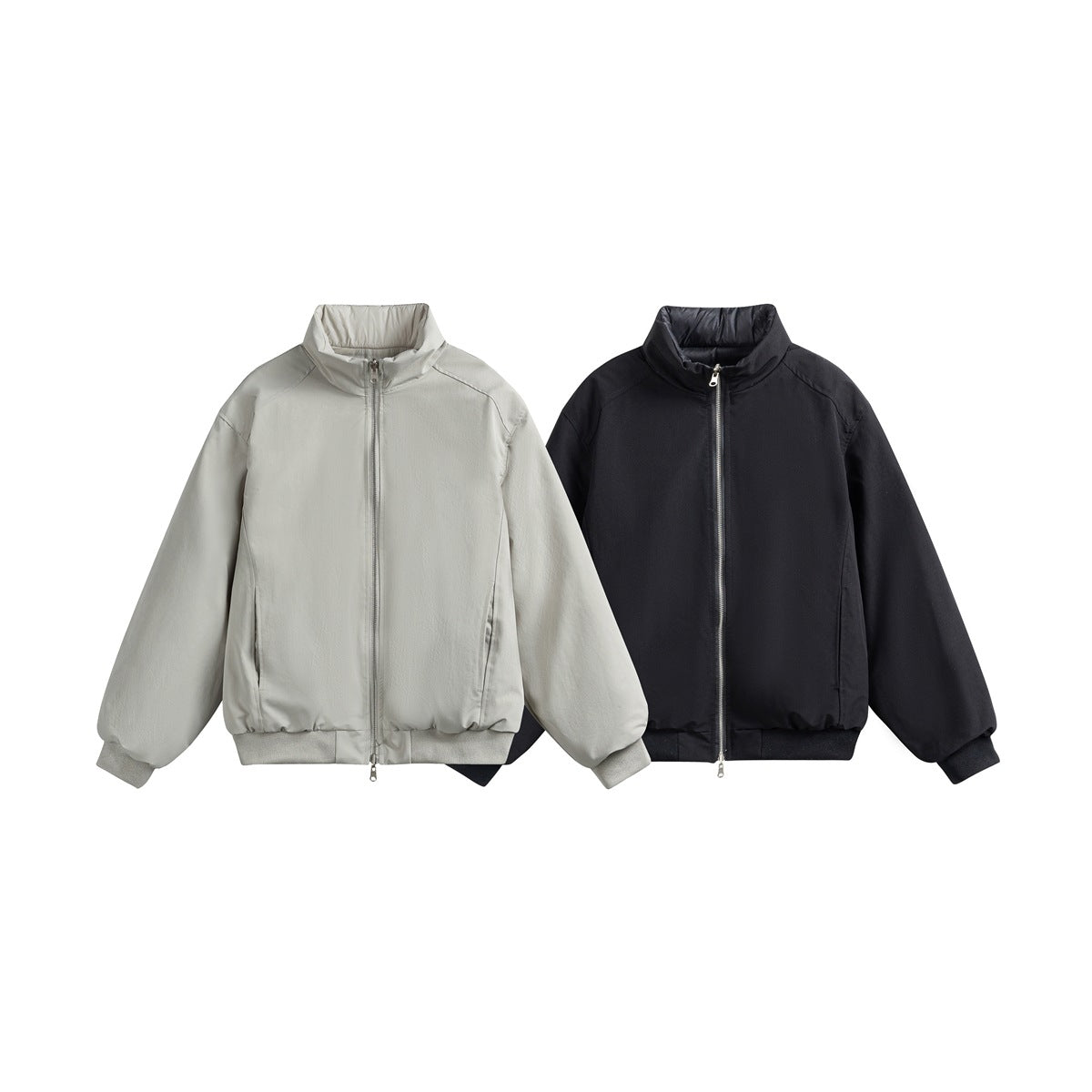 Two front-view jackets with stand collars and zip closures, one light gray and one black.