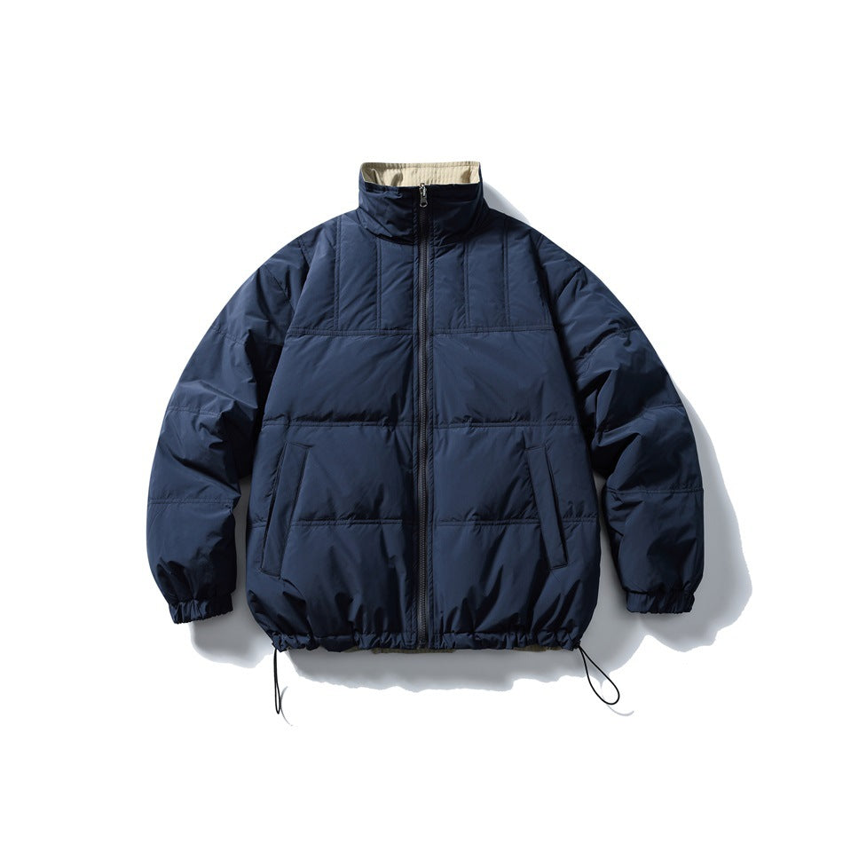 Front view of a navy padded jacket laid flat, with a high collar, zip closure, side pockets and drawcord hem.