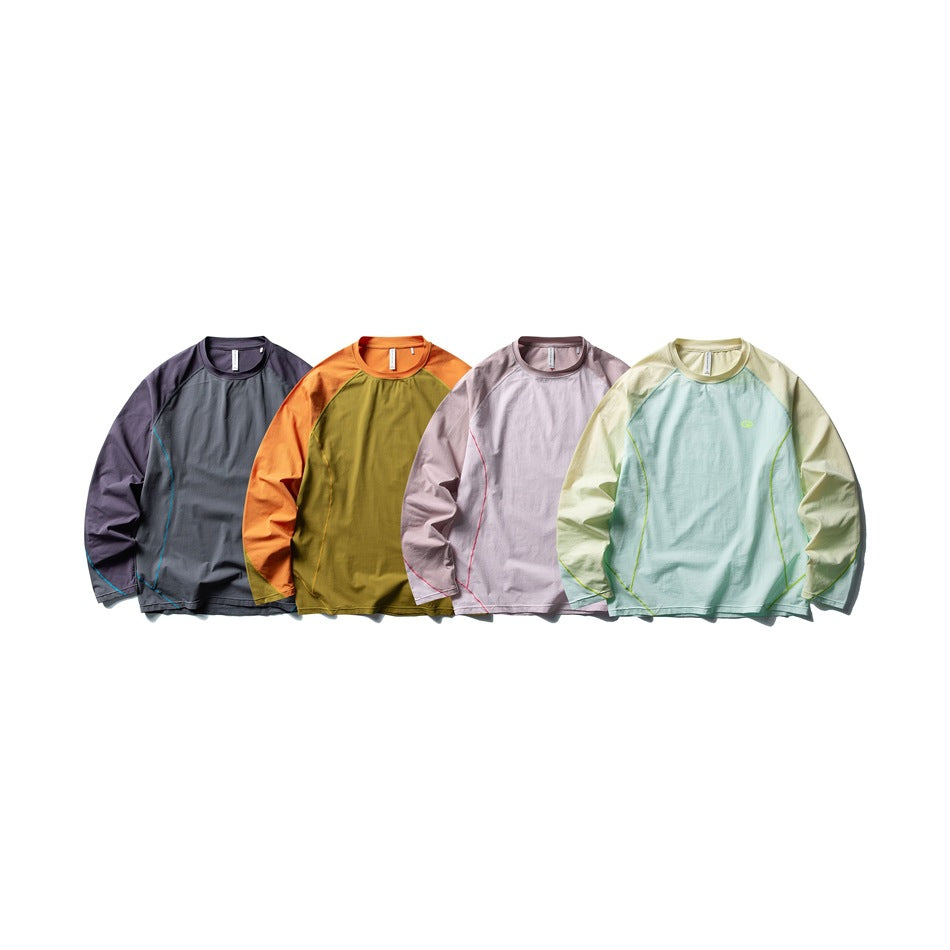 Four long-sleeve color-block shirts displayed together in charcoal and purple, olive and orange, pale pink, and mint and
