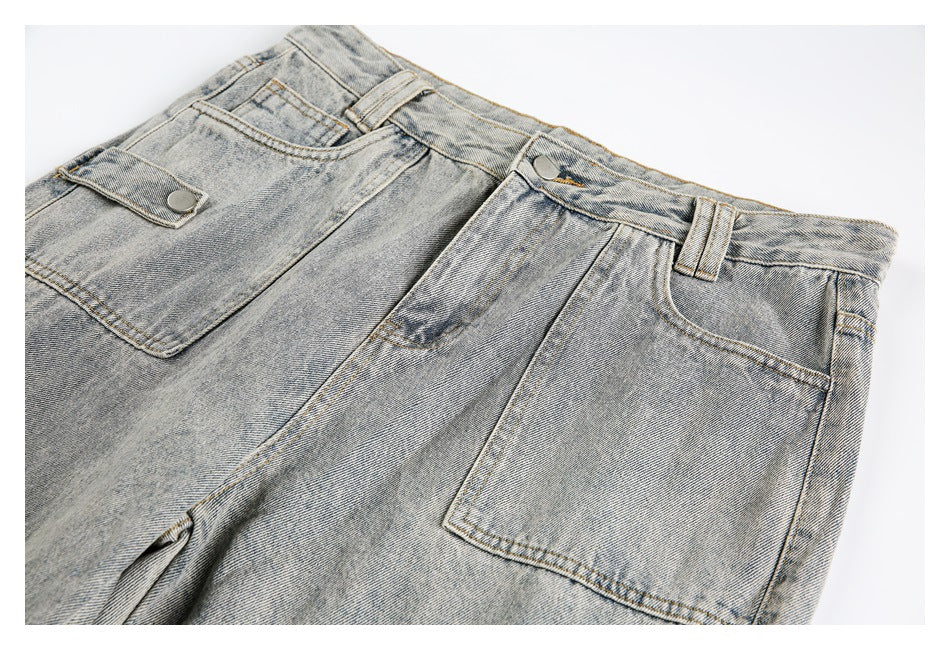 Close-up of the jeans' waistband, button, belt loops, front pockets, and large cargo pocket.