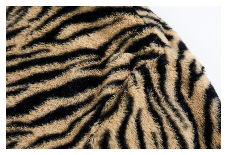 Close-up showing the dense tan-and-black tiger-stripe pattern and plush texture of the garment.
