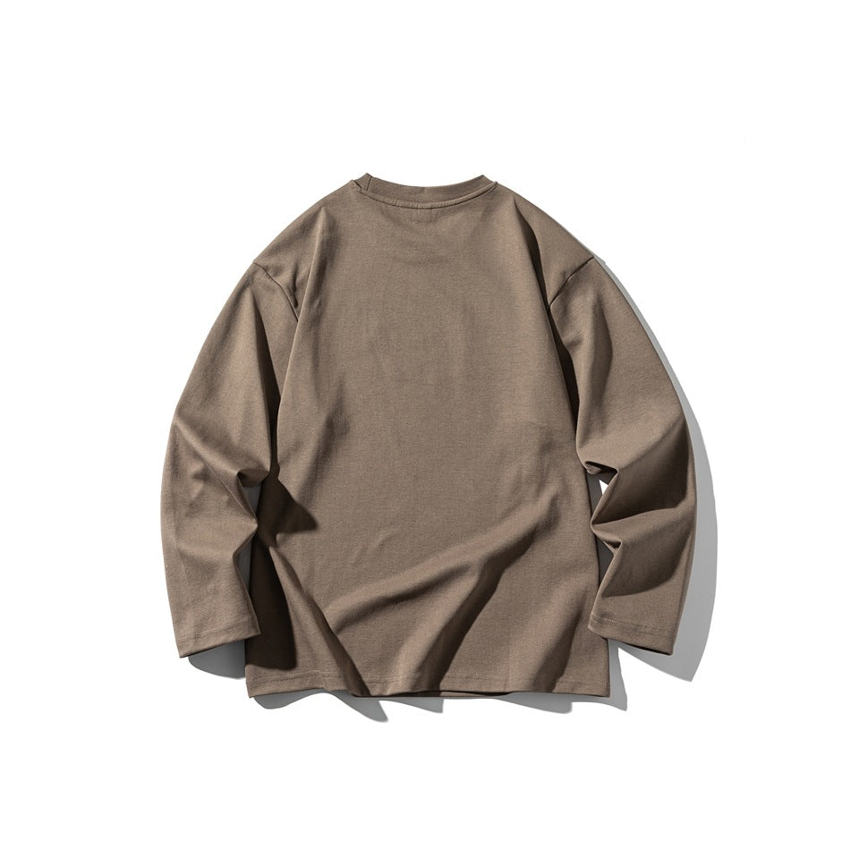 Taupe long-sleeve crewneck top displayed flat against a white background.