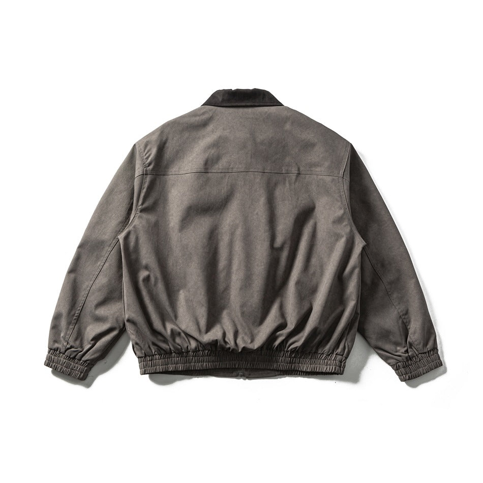 Back view of dark gray jacket showing back yoke seam, brown collar, elastic cuffs and hem band, flat lay