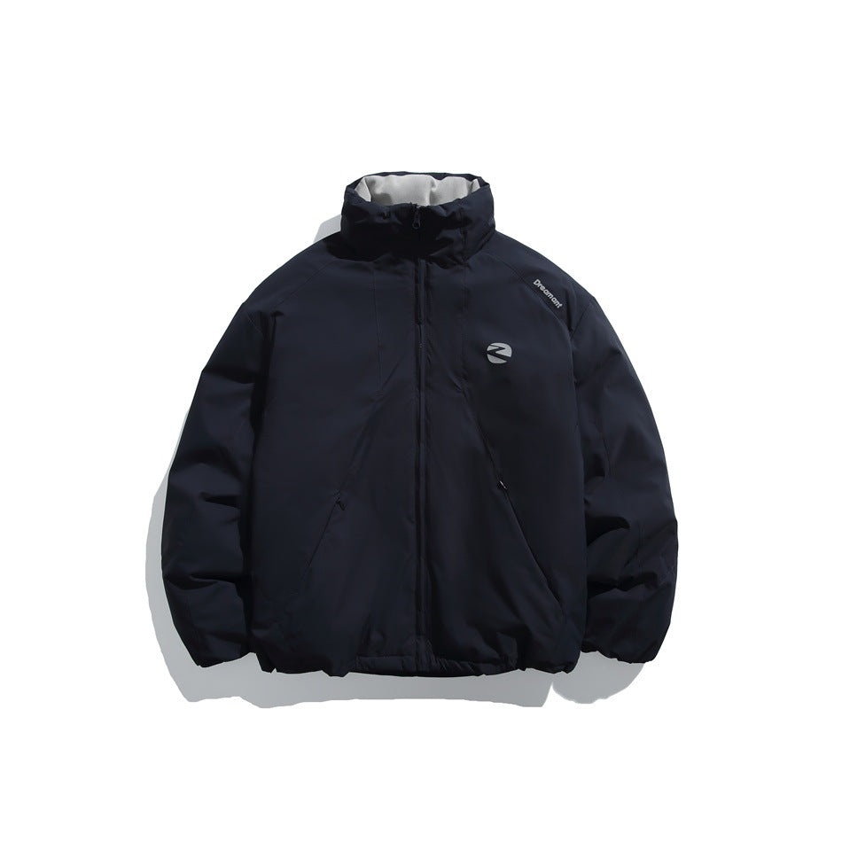 Front view of a dark navy zip jacket with a high collar, long sleeves, angled pockets and a chest emblem.
