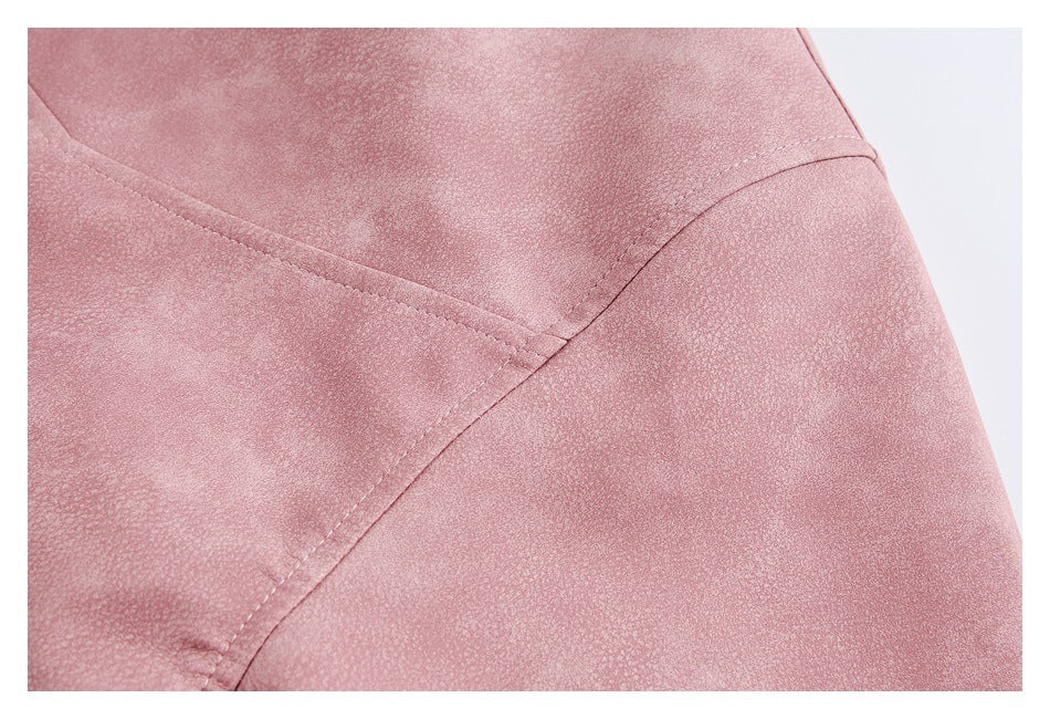 Close-up of dusty rose jacket fabric with curved stitched panel seams.