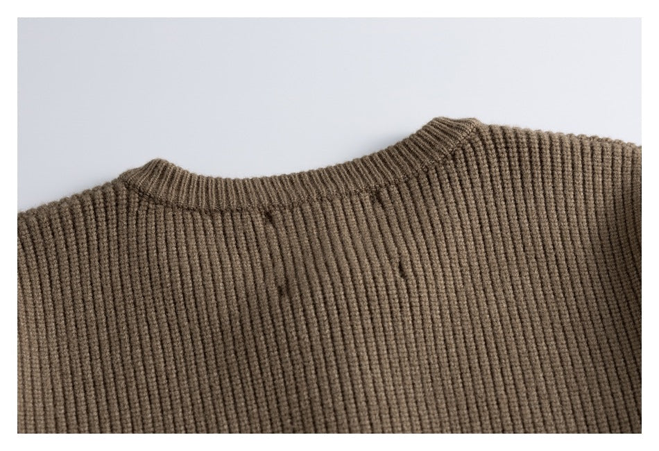 Close-up of the brown rib-knit cardigan's crew neckline and upper back.