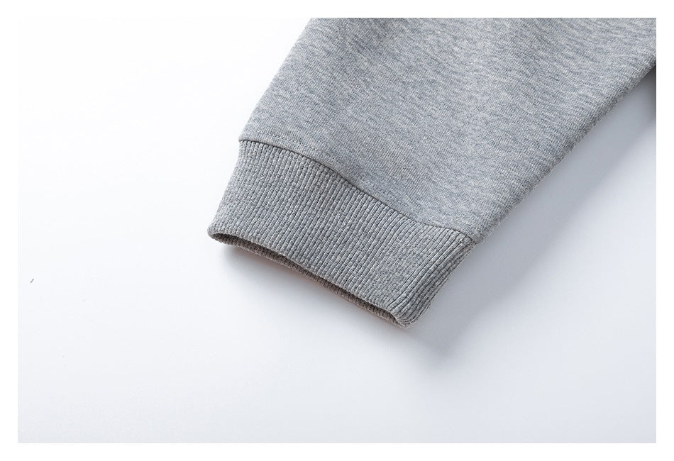 Close-up of a gray heather sleeve ending in a ribbed cuff.