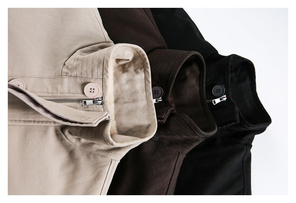 Close-up of taupe, dark brown, and black jacket collars with buttoned straps and zipper details.