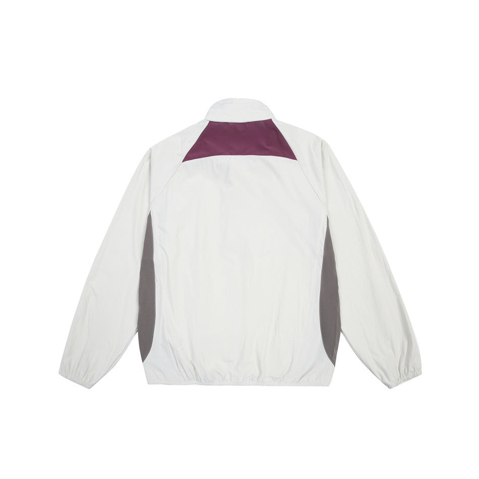 Back view of a white long-sleeve jacket with a burgundy upper-back panel and dark gray side panels.