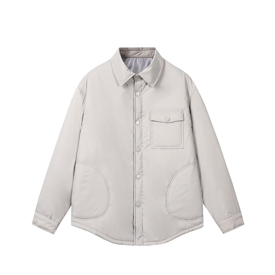 Light gray quilted shirt-style jacket with snap front, chest flap pocket and two rounded lower pockets, flat lay