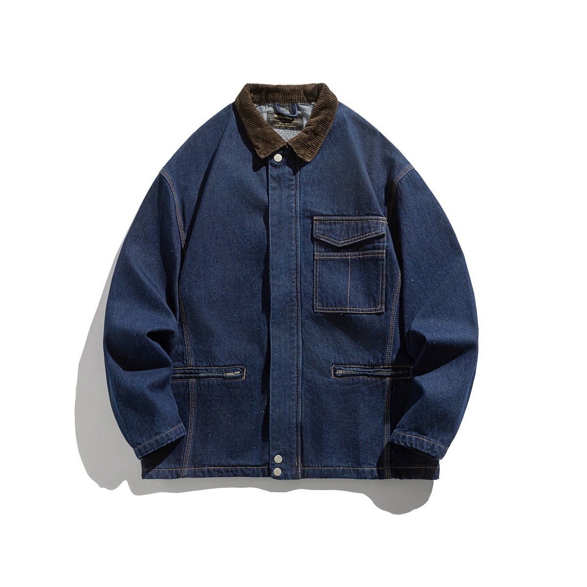 Dark blue denim jacket with brown corduroy collar, chest flap pocket and zip pockets, laid flat, front view