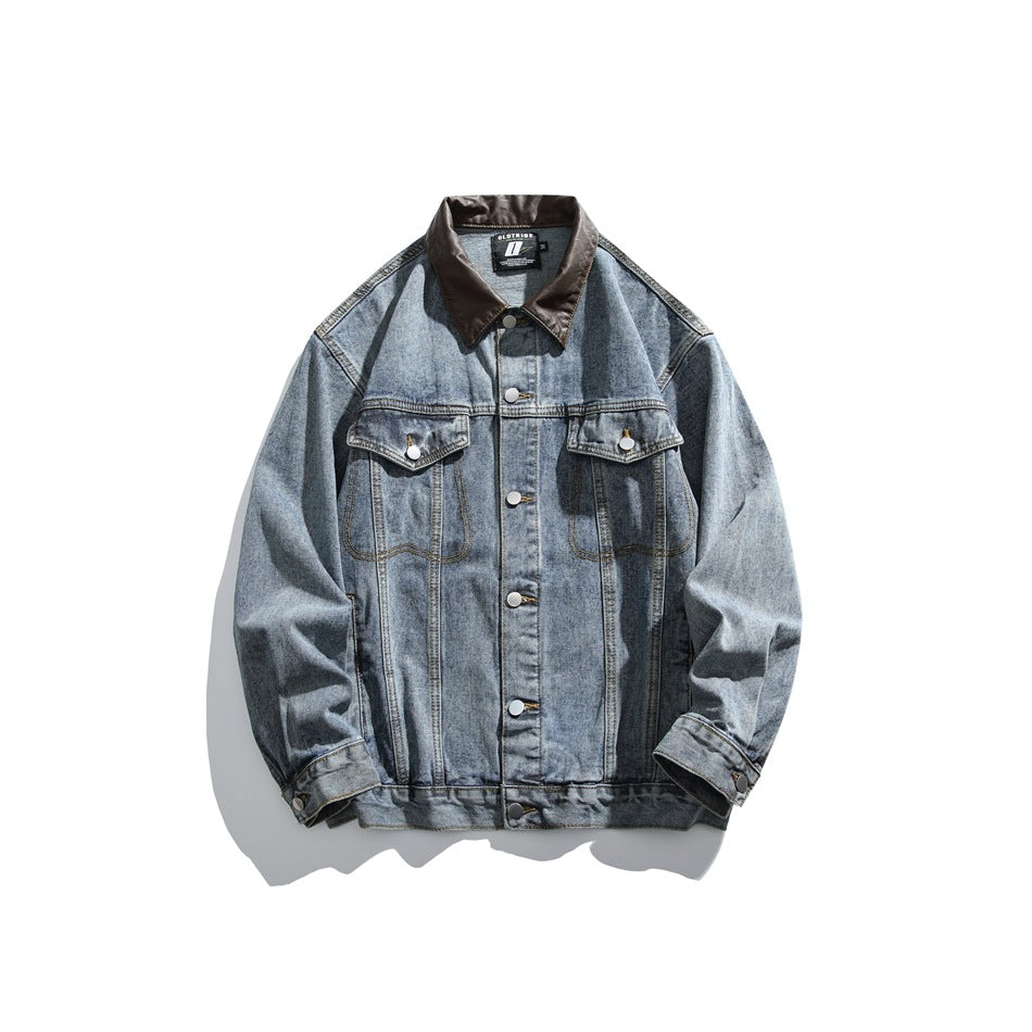 Front view of a blue denim jacket with a dark brown collar, metal buttons, and two flap chest pockets.