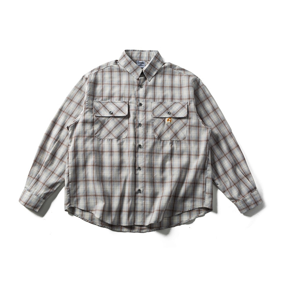 Gray and blue plaid long-sleeve button-up shirt with two flap chest pockets, laid flat, front view