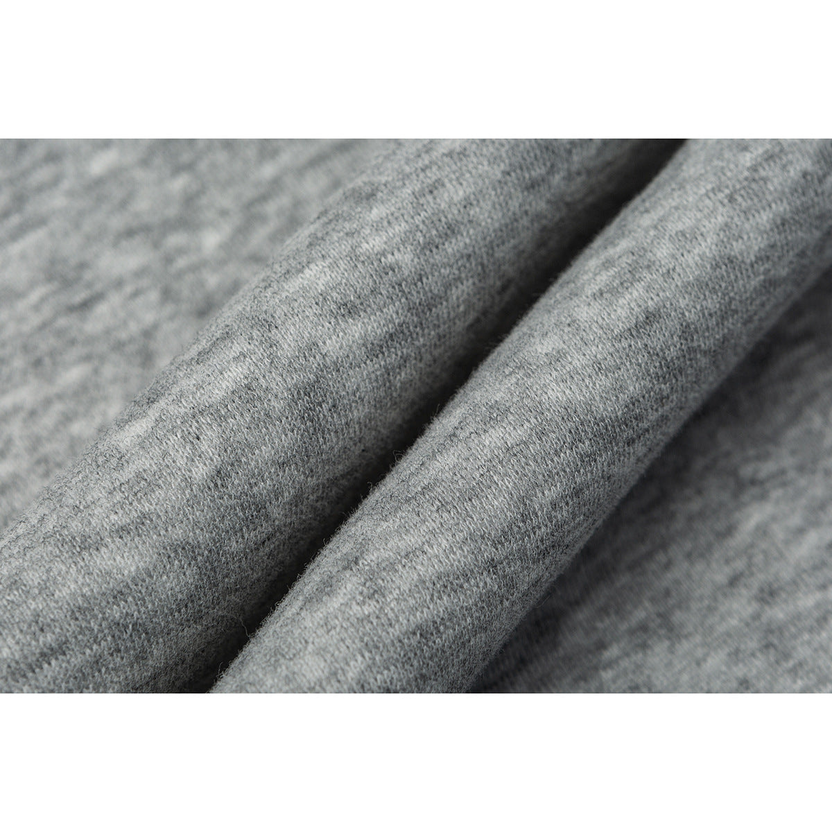 Macro view of the heather gray knit fabric, showing its surface texture.