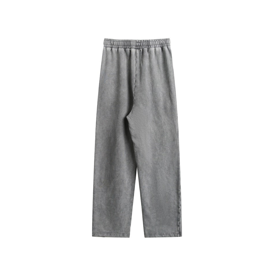 Gray wide-leg sweatpants laid flat, showing an elastic waistband and full-length legs.