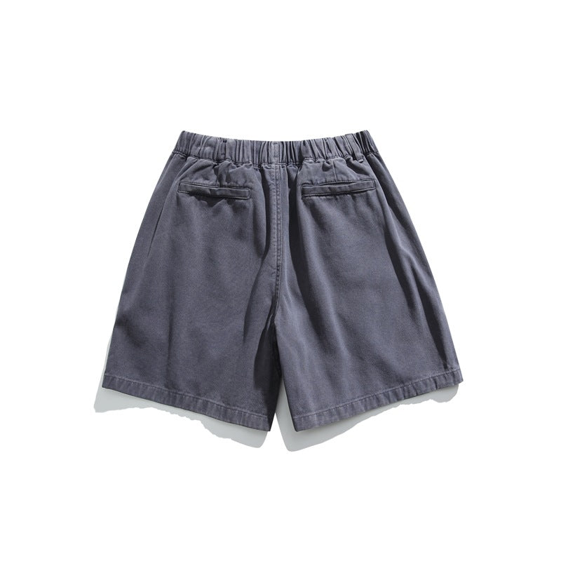 Rear view of slate blue-gray shorts with an elastic waistband and two back pockets, displayed flat on white.