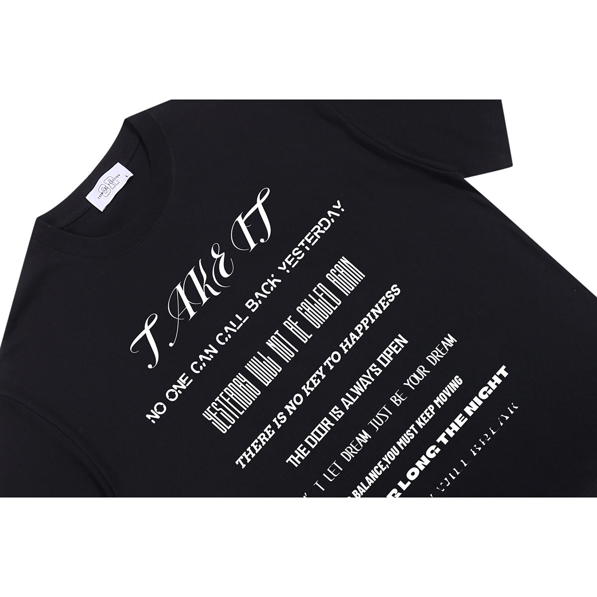 Angled close-up of a black T-shirt with a large white text graphic across the front.