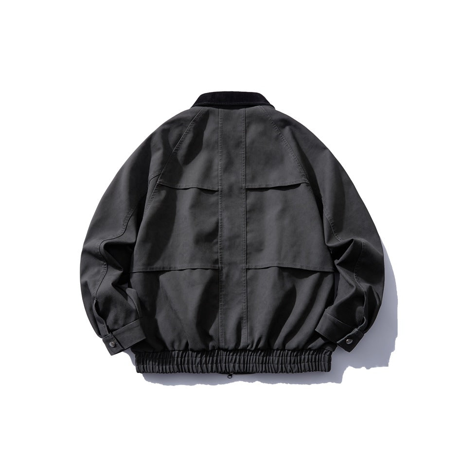 Dark gray jacket back view with black corduroy collar, paneled back seams, snap cuff tabs and elastic hem