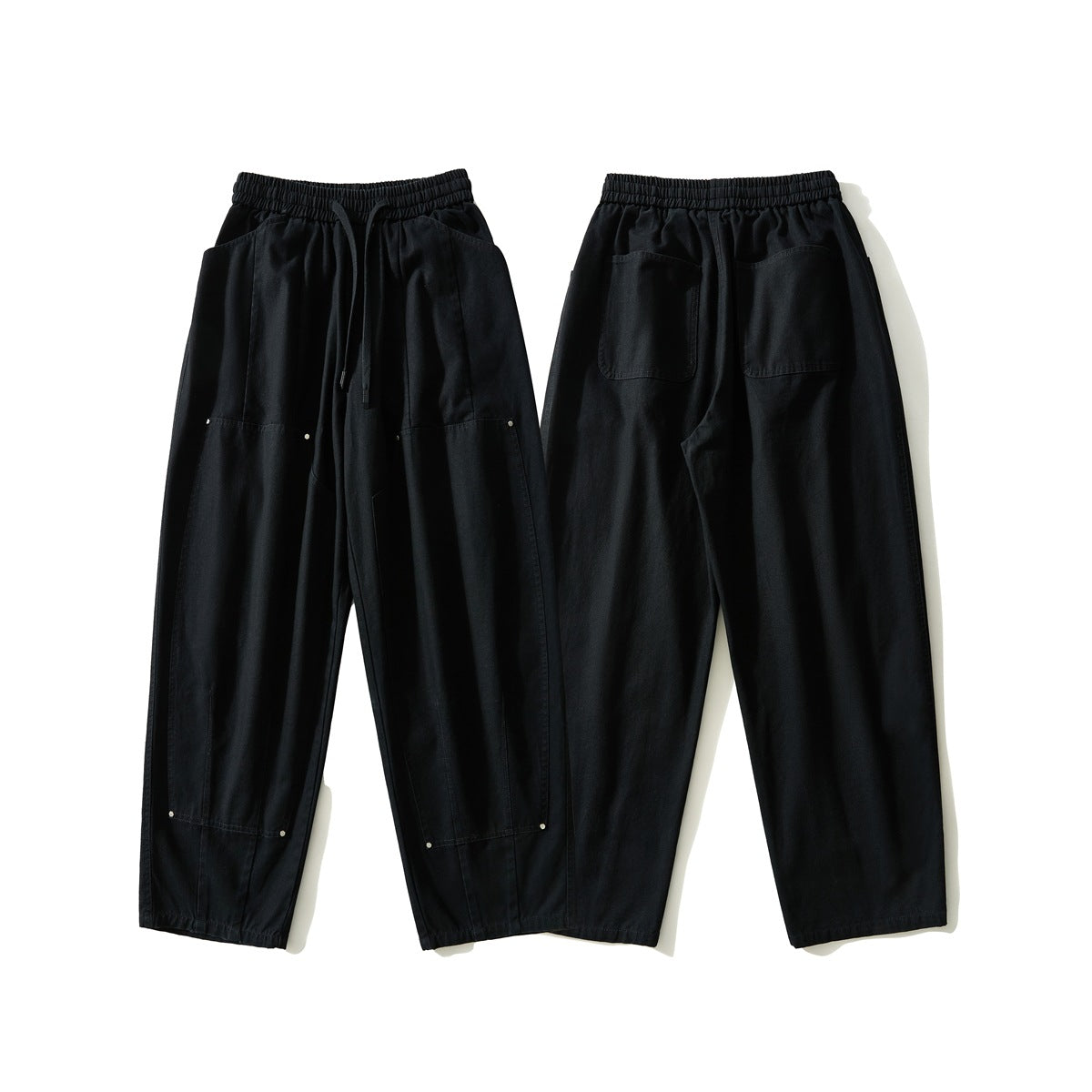 Black pants shown from the front and back, with an elastic drawstring waist, patch pockets and panel details.