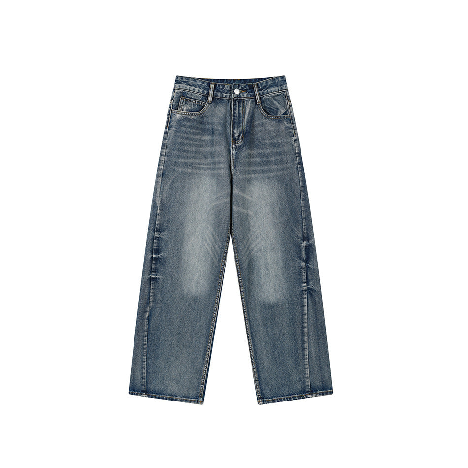 Front of faded blue wide-leg denim jeans with button fly, belt loops and whiskered wash