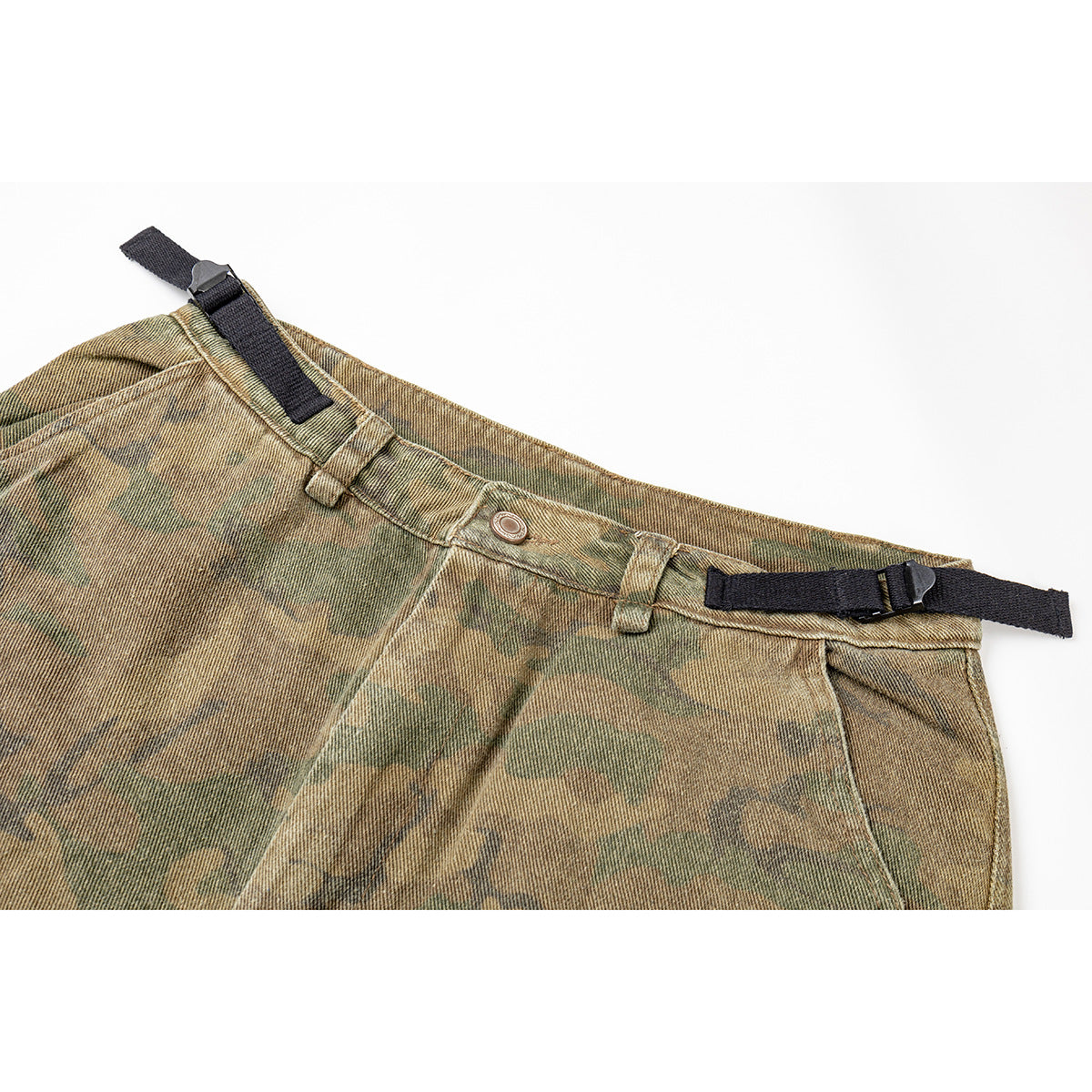 Close-up of the camouflage cargo pants’ front waistband, button, belt loops, and black adjustable side straps.