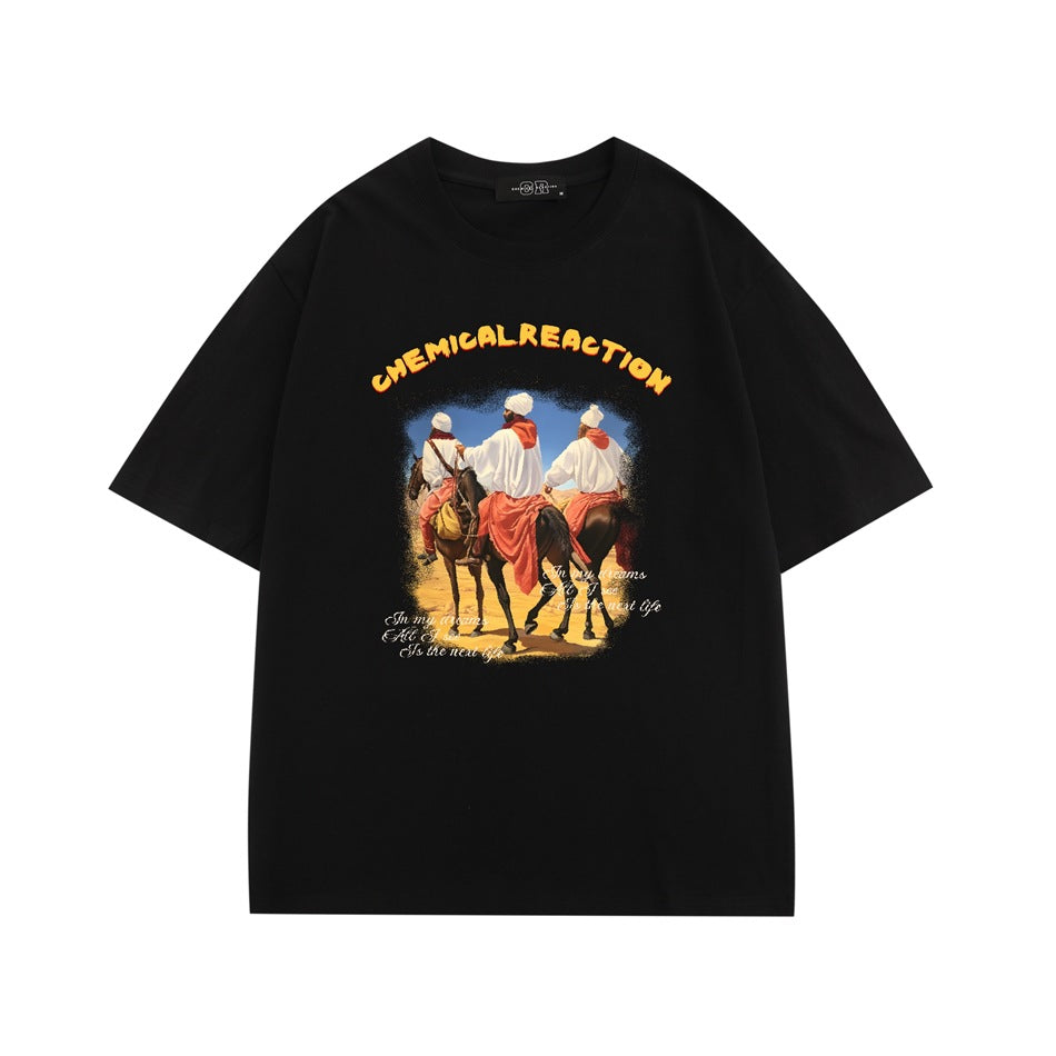 Black short-sleeve T-shirt with desert riders on horseback graphic and yellow CHEMICAL REACTION lettering