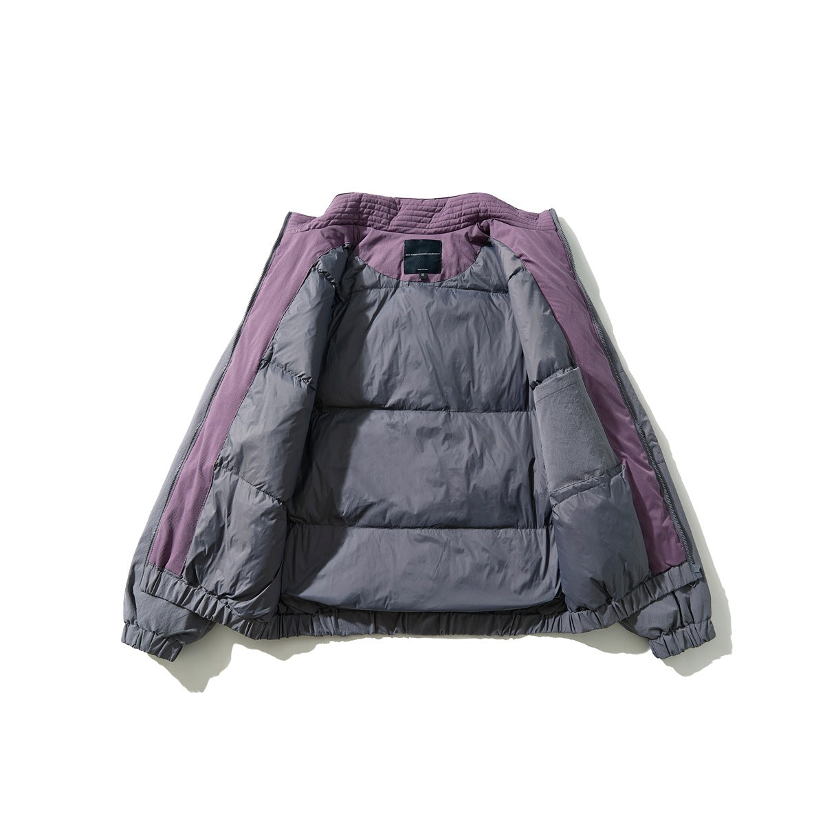 Gray jacket opened to show its plum inner panels, quilted collar, and gray lining.