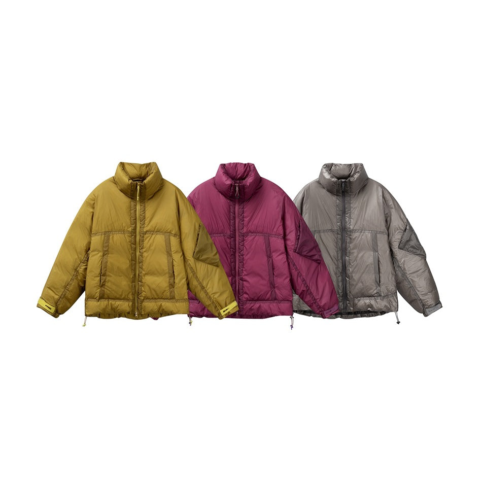 Three puffer jackets shown from the front in mustard yellow, magenta, and light gray.