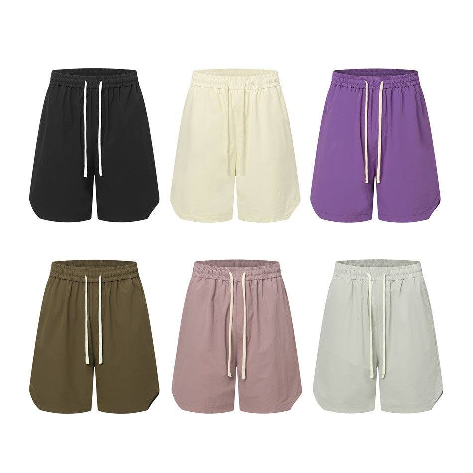 Six drawstring shorts in black, cream, purple, olive green, dusty pink and light gray arranged in a grid