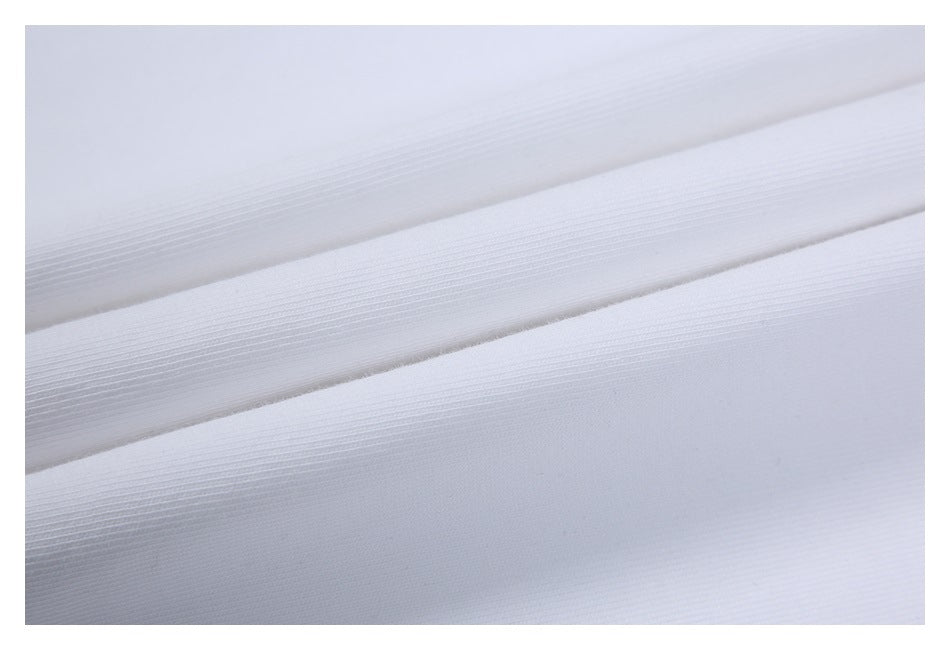 Close-up of the fine texture and folds of white fabric.
